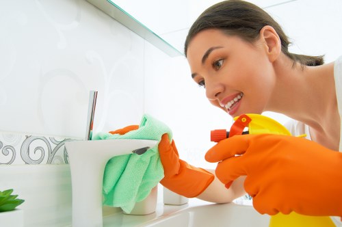 Professional Clapham cleaner reviewing workplace hazards and safe procedures