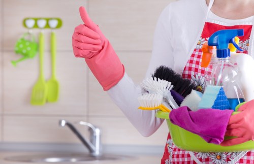 Cleaners in Clapham finishing a spotless home and workplace cleaning service