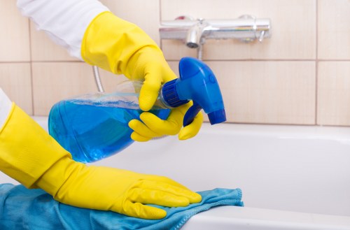 Professional carpet cleaner working in a Clapham home