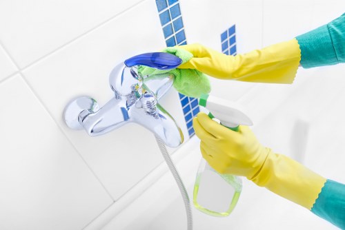 Safe and professional cleaning team following health and safety rules